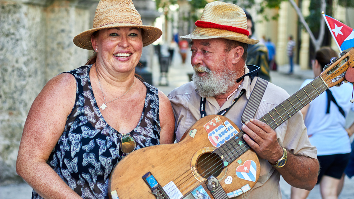 tourist enjoying music in the street, travel to cuba