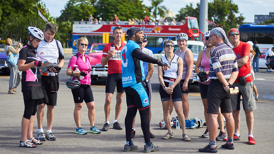 Jocsan Herrera having an animated chat with cyclists in Havana's Revolution Square