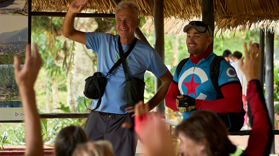 Tour guide Erick Garcia answering questions in briefing meeting previous cycling tour in Cuba