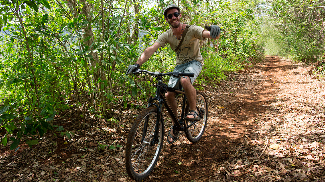 Cyclist, riding the trails around Vinales Valley, saying 'Hi' to the camera