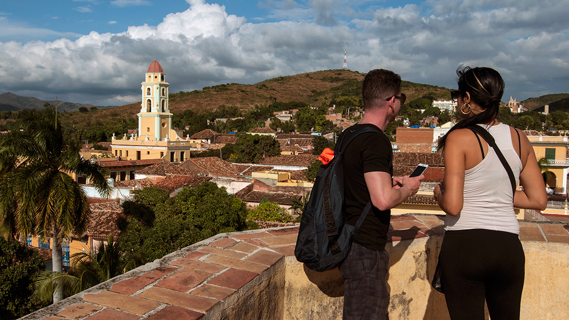 Tourist enjoying the beautiful view of Trinidad from Palacio Cantero