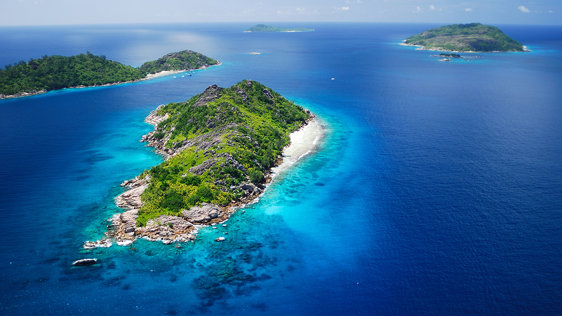 Beautiful aerial view of the Indian Ocean around Felicite and Sisters Island in the Seychelles